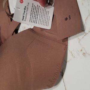 NWT Lululemon Hold True Bra 32d. Brown color and in brand new condition.